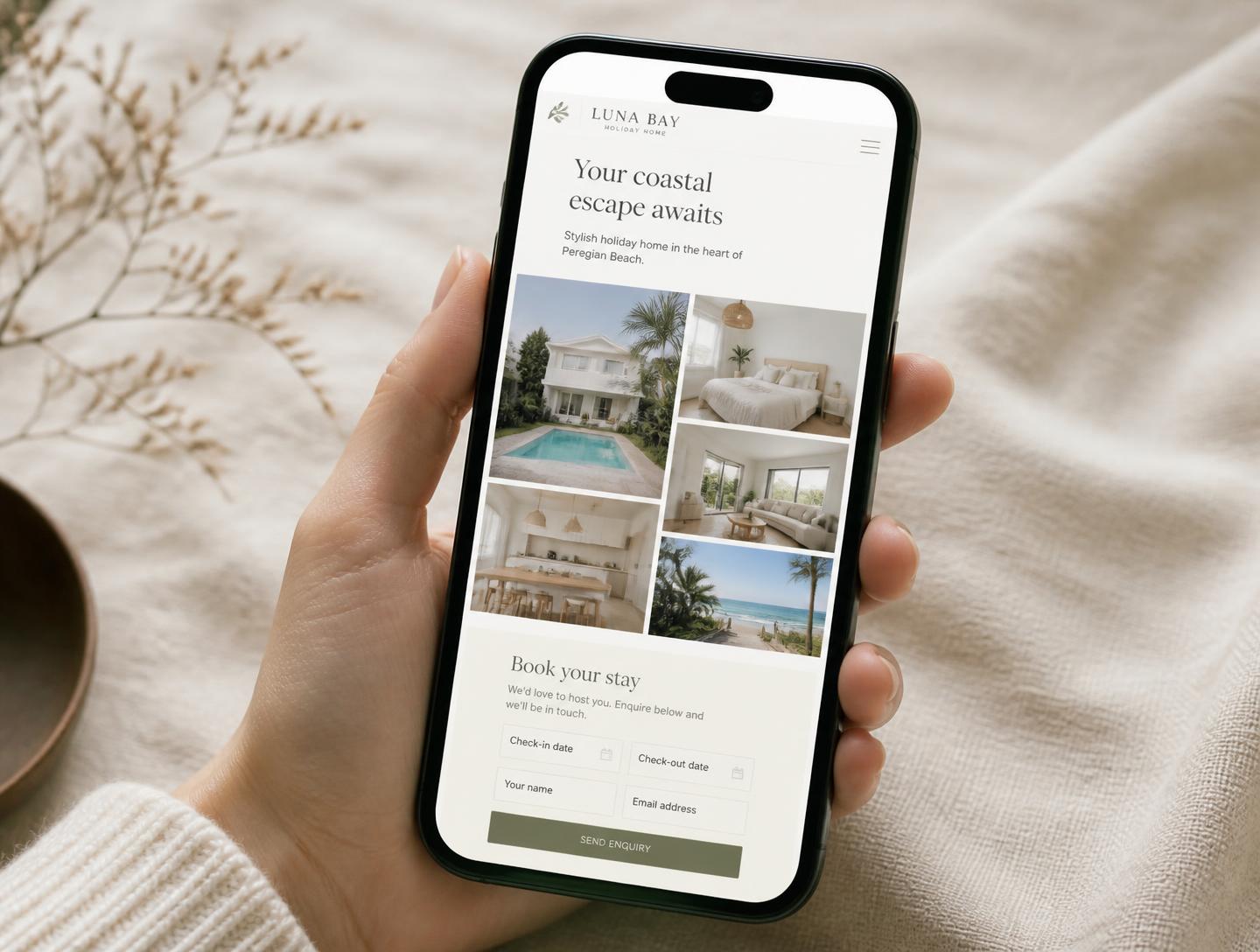 Phone showing a vacation rental website with a photo grid and enquiry form